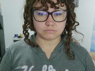 curly-greeneyed