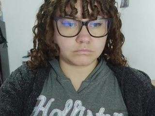 curly-greeneyed