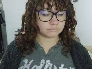 curly-greeneyed